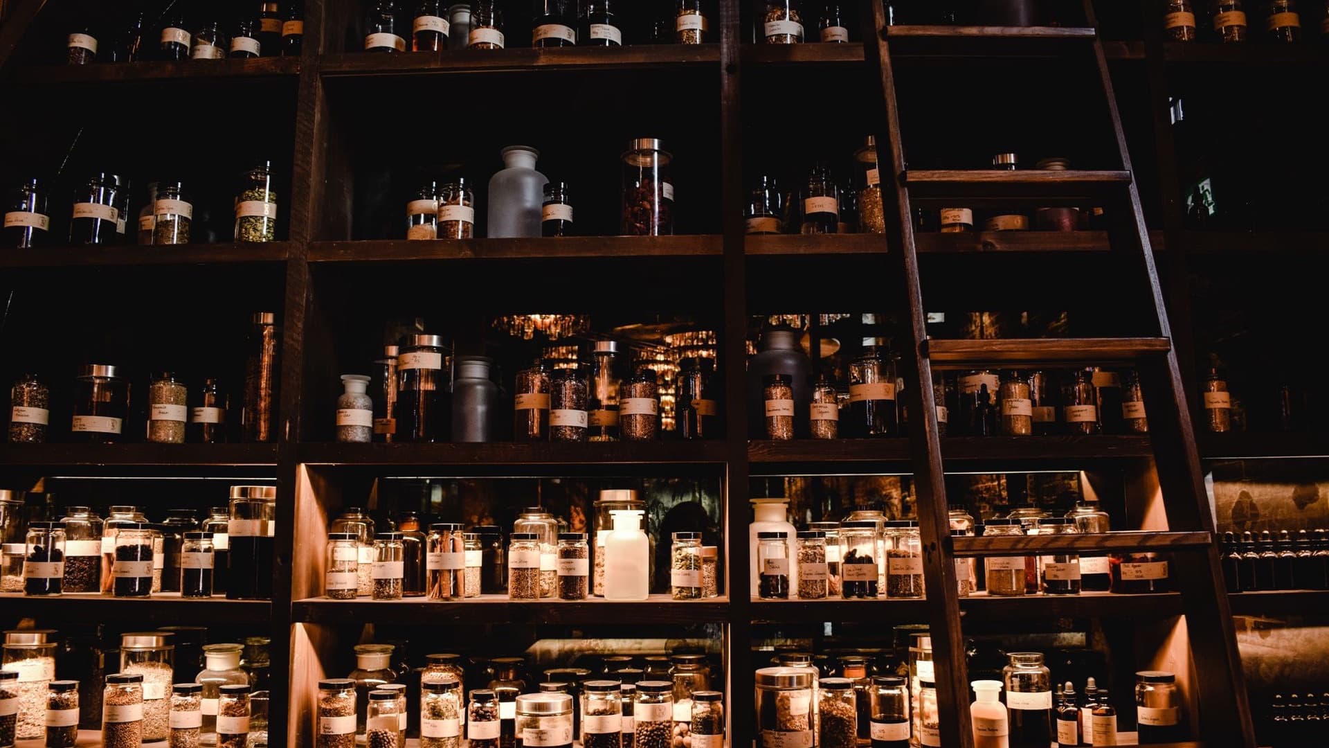 The homoeopathic dispensary with neatly organised remedies in amber glass bottles